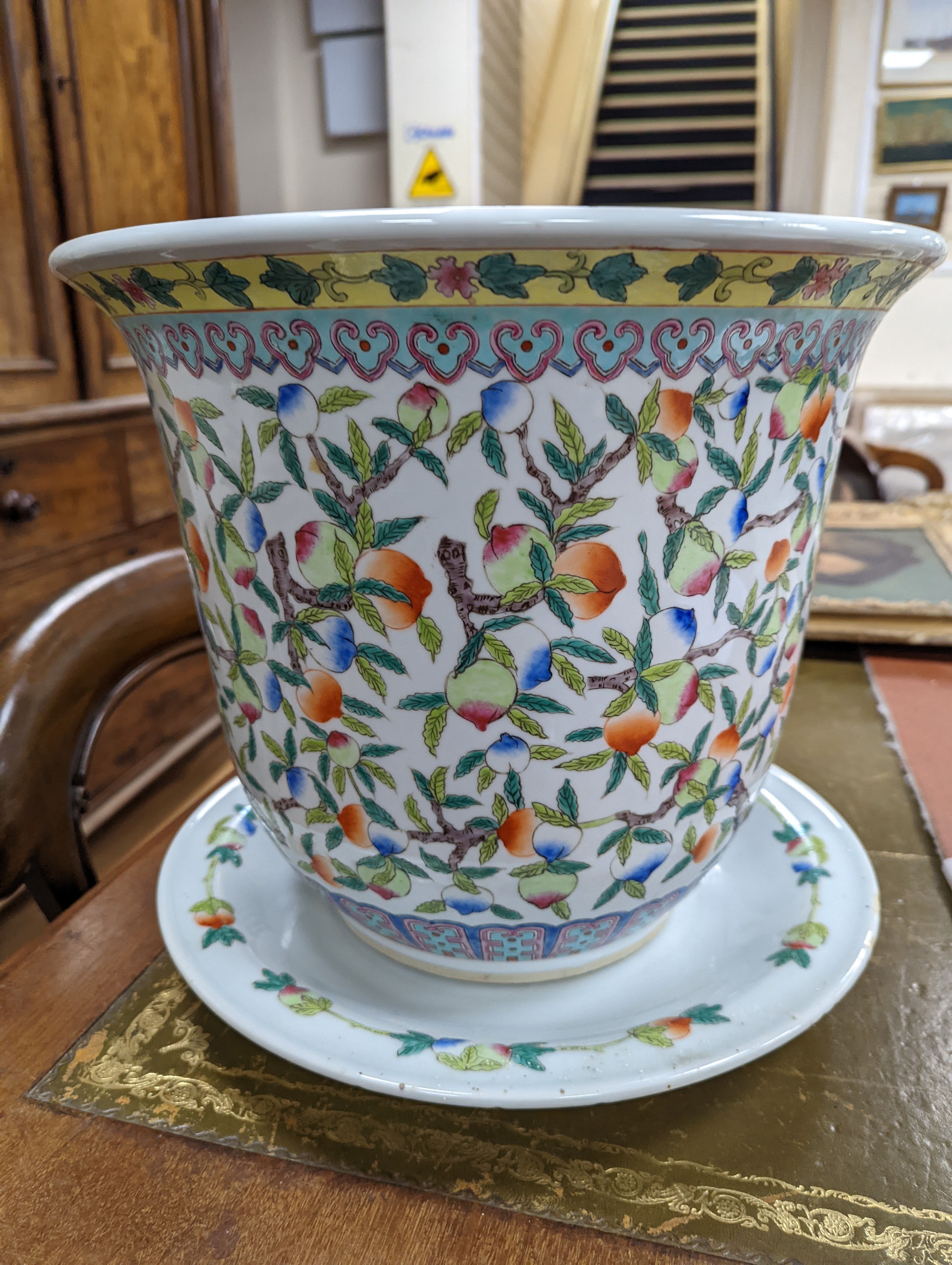 A 20th century Chinese porcelain jardiniere and dish, diameter 36 cms.